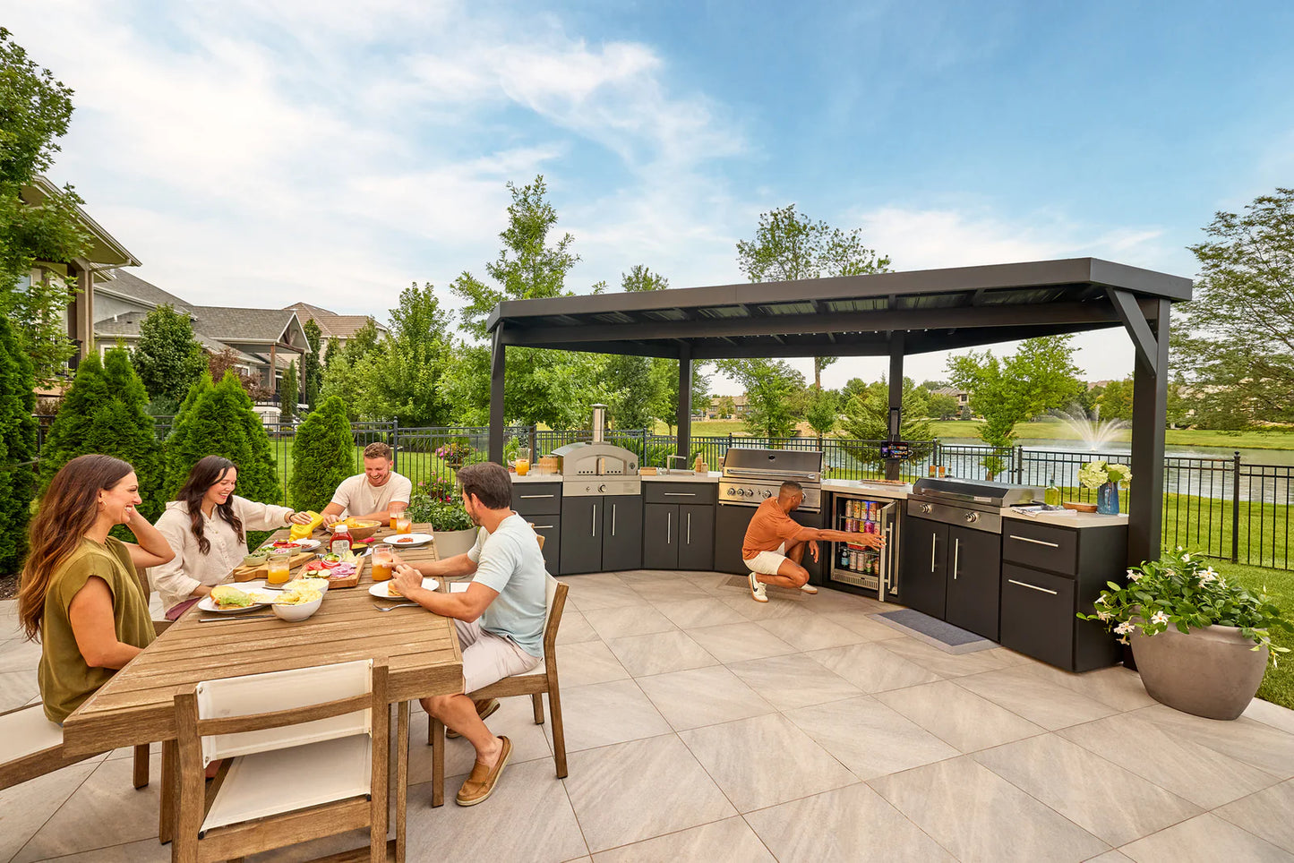 Edgemont Cove | Curved Outdoor Kitchen with Built-In Grill, Griddle & Pizza Oven